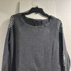 Inc thigh length sweater with rhinestones.